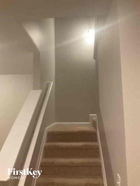 a staircase with a light on the top of it