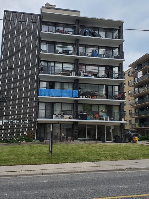 an apartment building on the side of a street