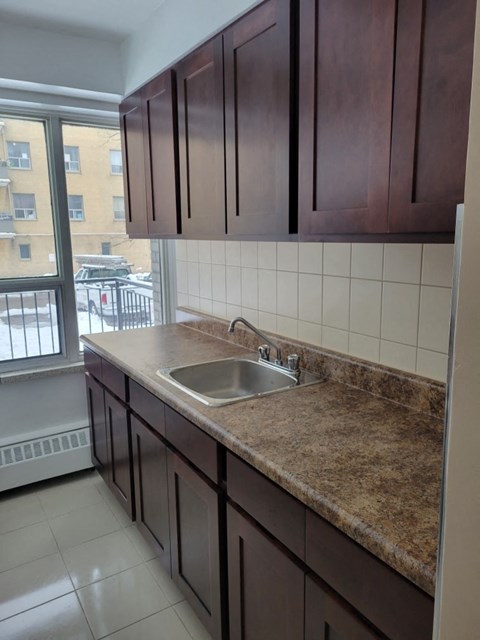 a kitchen with a sink and a window