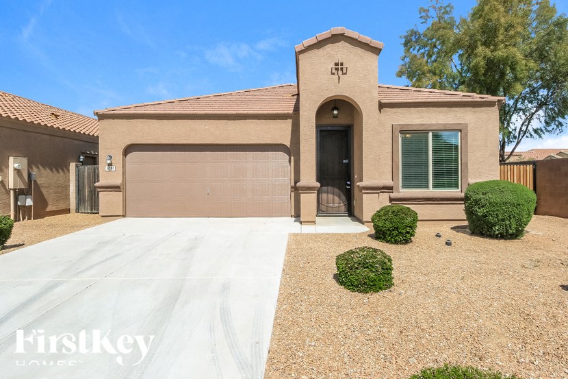A house with a brown facade and a black door is shown.