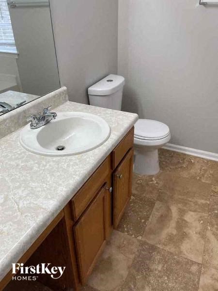 a bathroom with a sink and a toilet