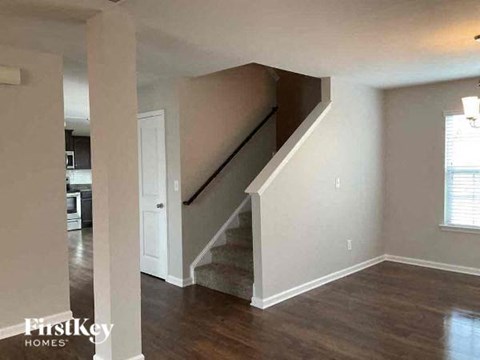a living room with a staircase in a house