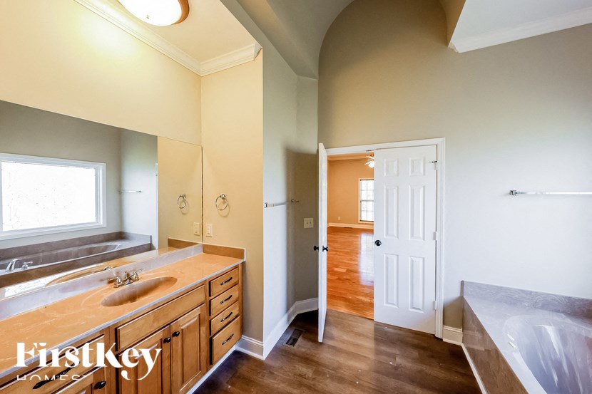 A kitchen with a sink and a window.