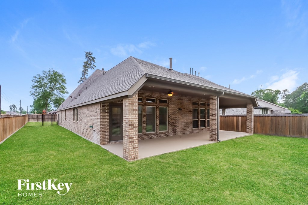 A house with a lawn in front of it.