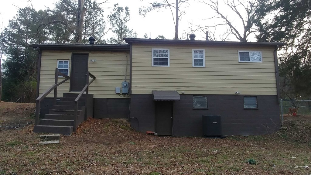 the front of the house has been sided and is ready to be painted