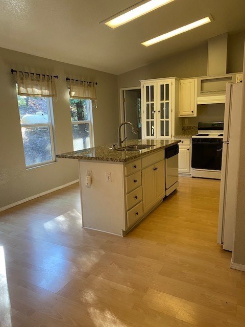 an empty kitchen with an island in the middle