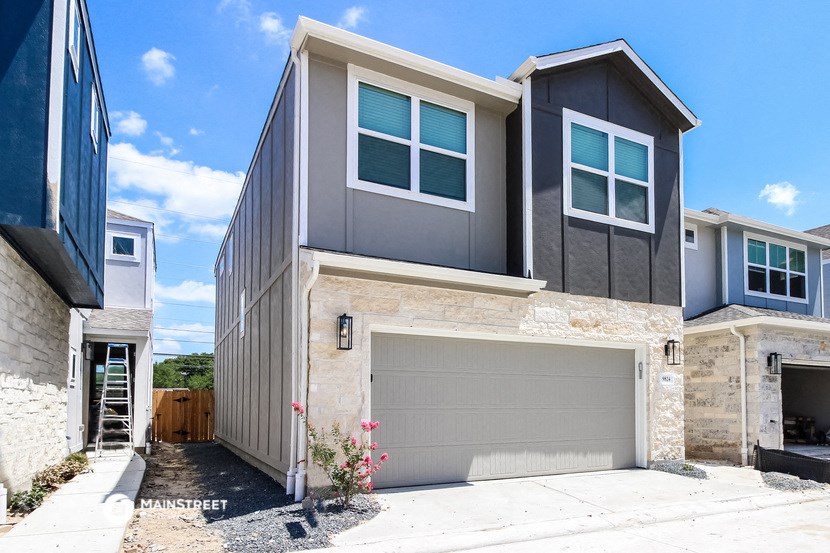 a new home with a garage door in front of it