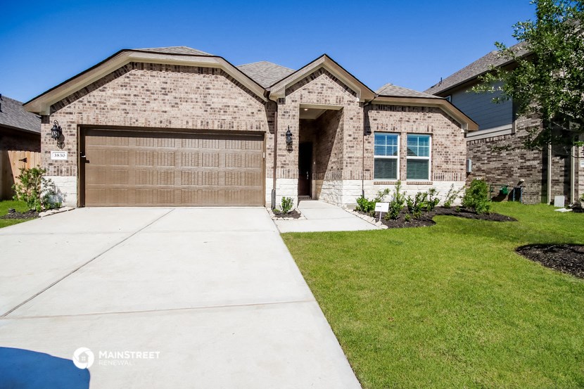 a house with a driveway and a garage door