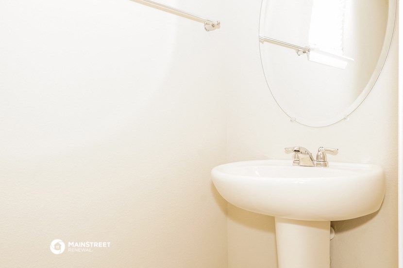 a small bathroom with a sink and a mirror and a toilet