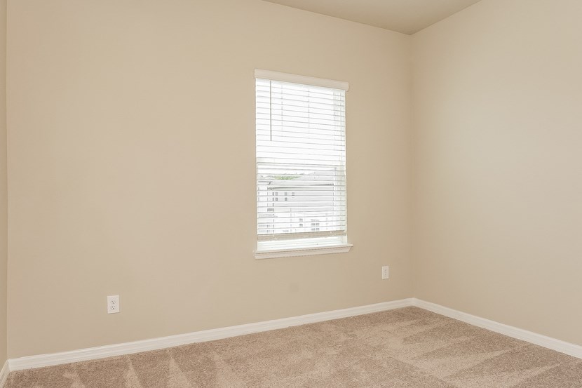 an empty room with a window in it