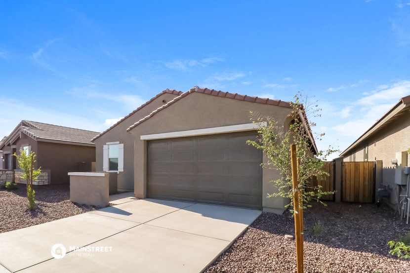 a house with a garage door and a driveway
