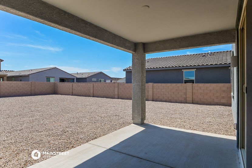 a view of the backyard from the patio of a house