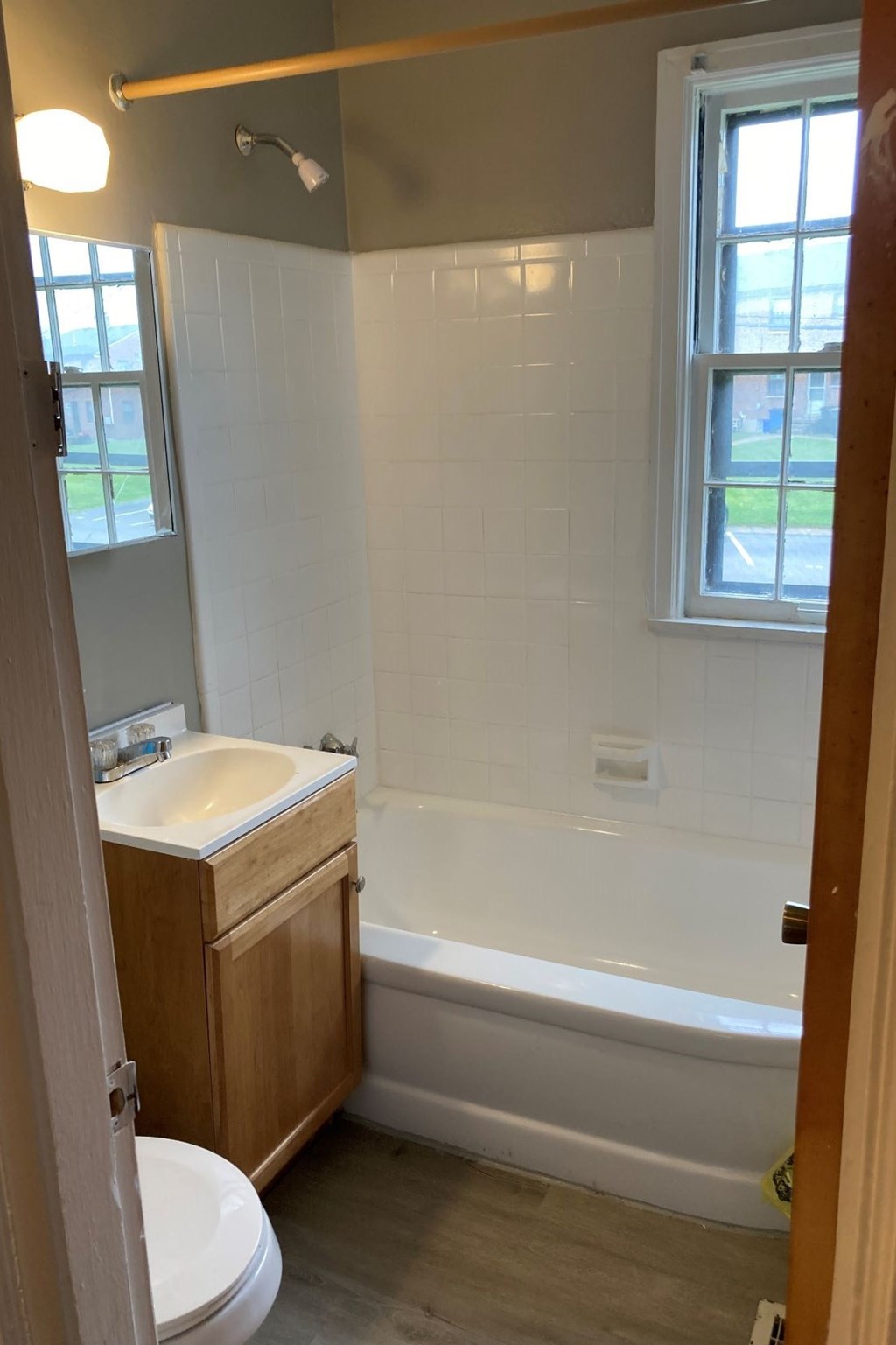 a bathroom with a tub and a sink and a toilet