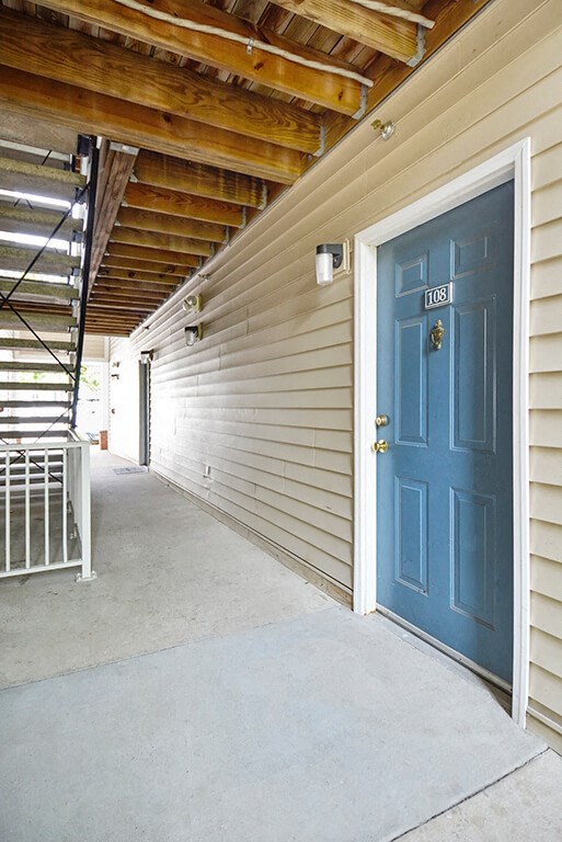 a blue door on the side of a building