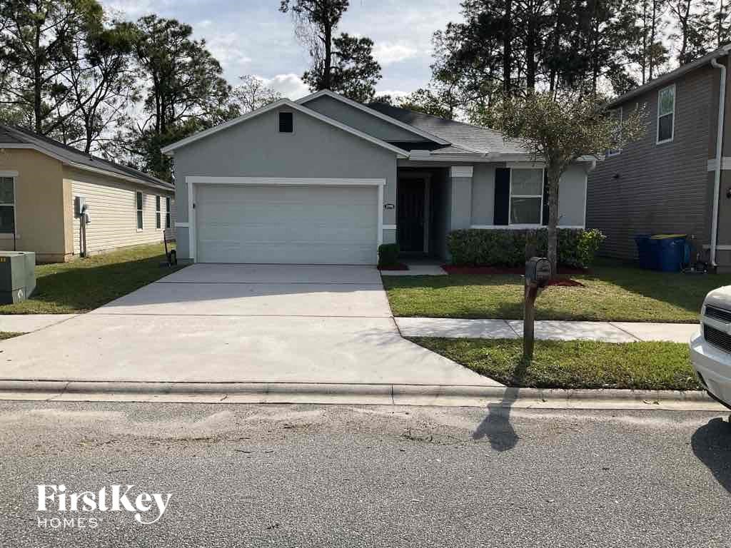 a house with a driveway and a white garage door