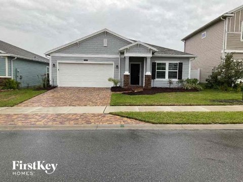 A house with a garage is for sale by FirstKey Homes.