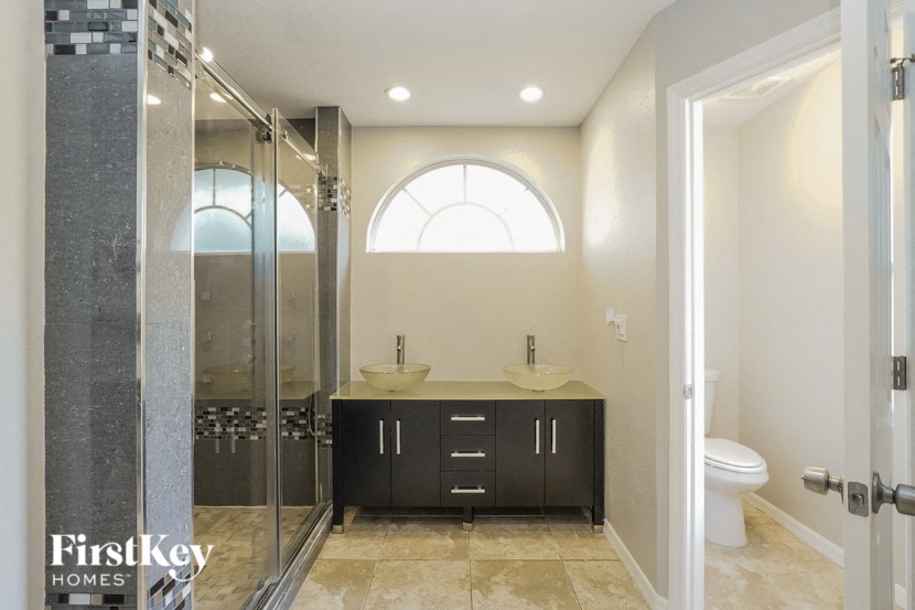 a bathroom with a toilet sink and a shower