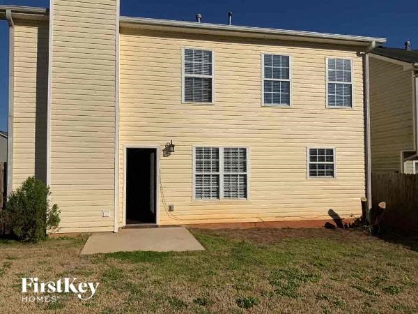 a yellow house with an open door