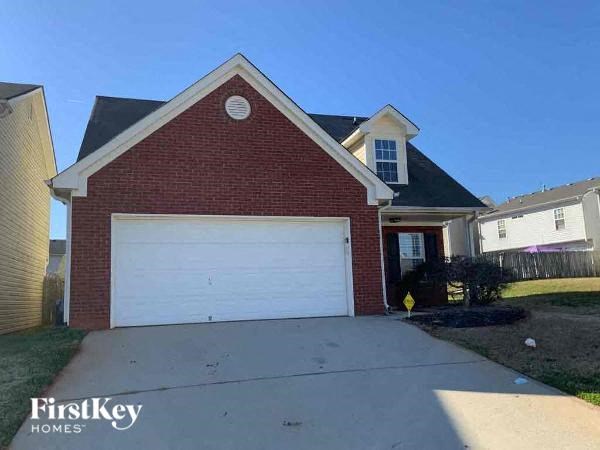 a brick house with a white garage door