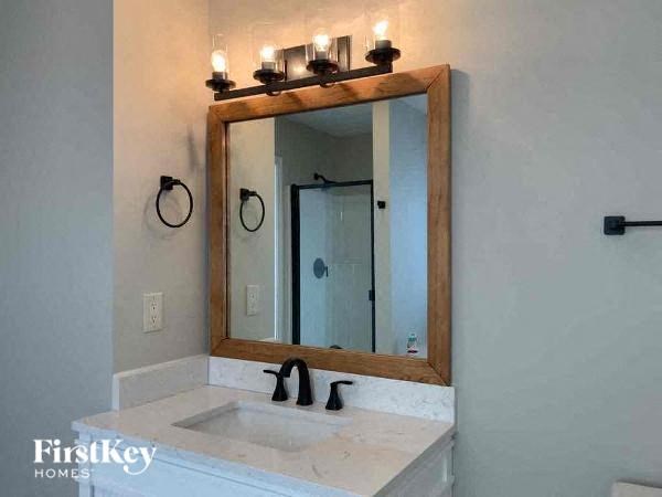 a bathroom with a sink and a mirror