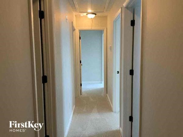 a long hallway with a light on the ceiling