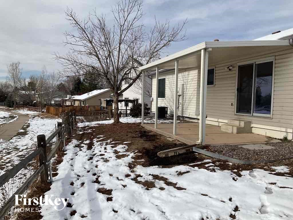 a house with a yard covered in snow