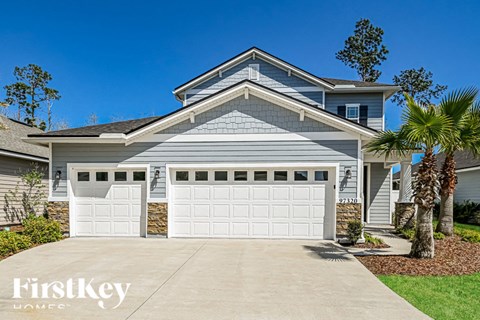 a house with a white garage door in front of it