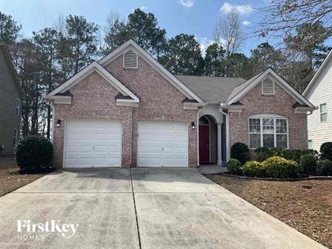 a brick house with a white garage door
