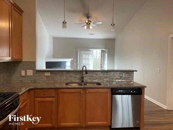 a kitchen with a sink and a refrigerator