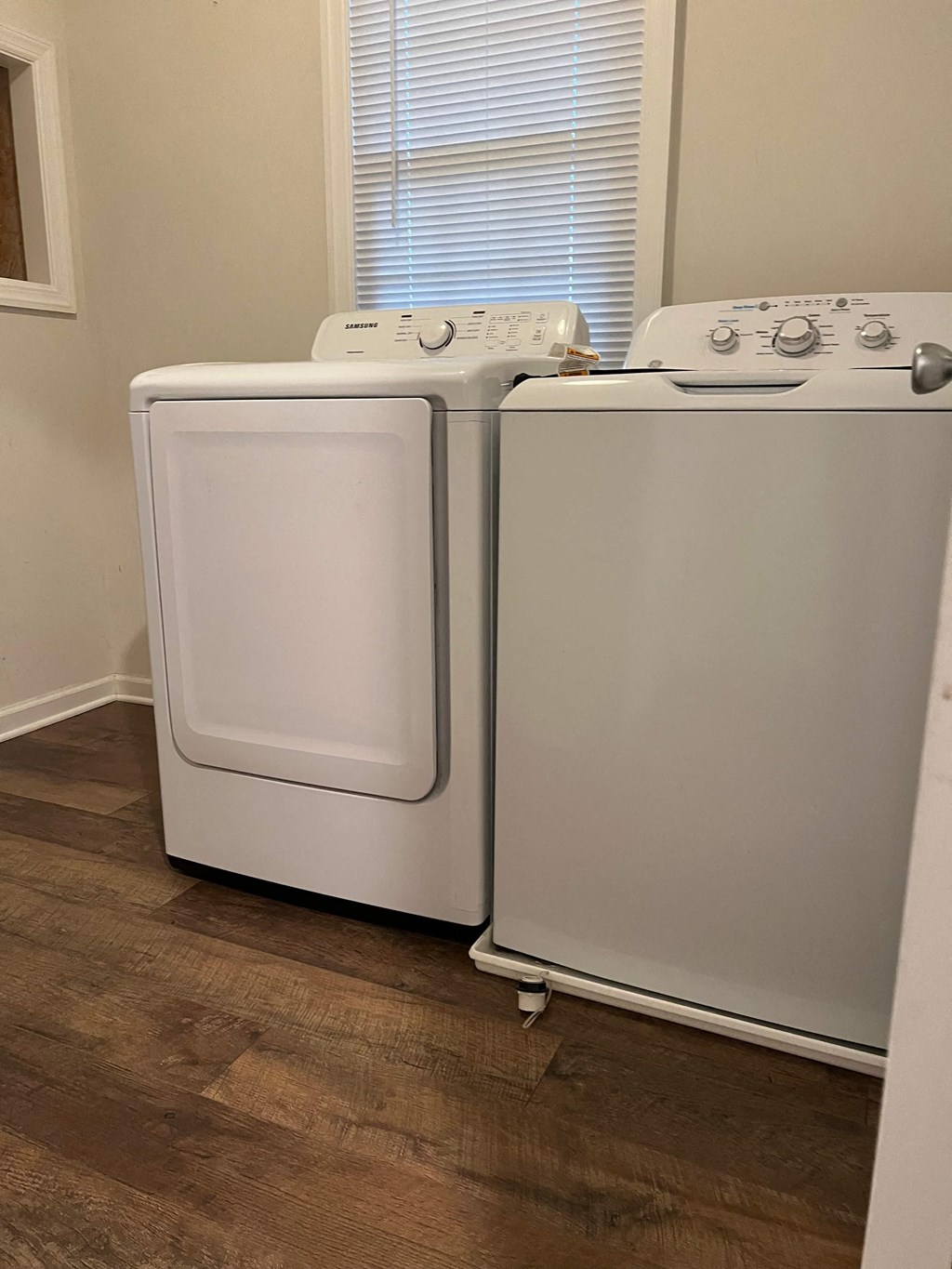 a washer and dryer in a room with a window