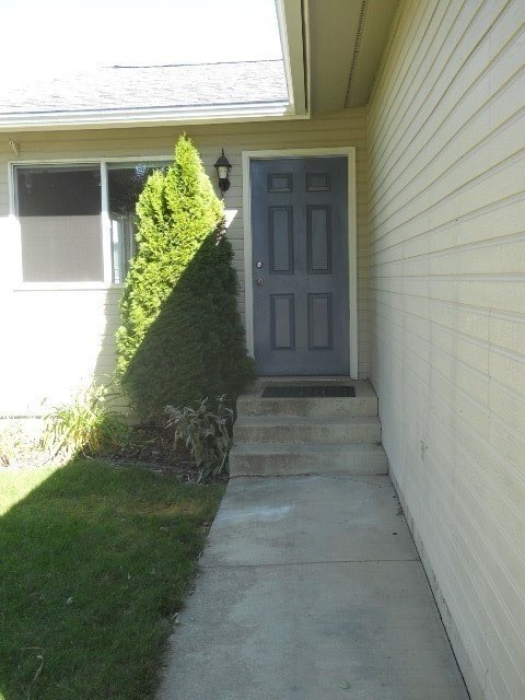 a blue door on the side of a house