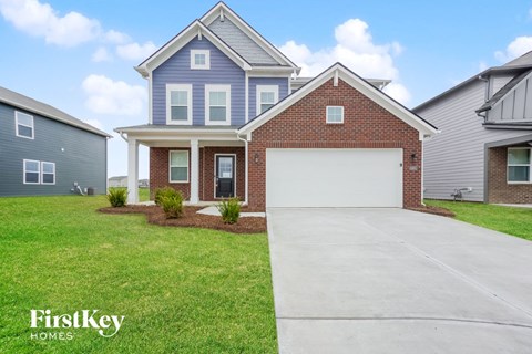 A house with a garage is for sale by FirstKey Homes.