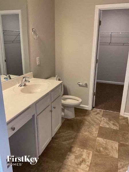 a bathroom with a sink and a toilet and a shower