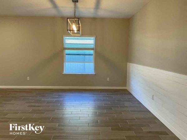 a empty empty room with a window and a light fixture