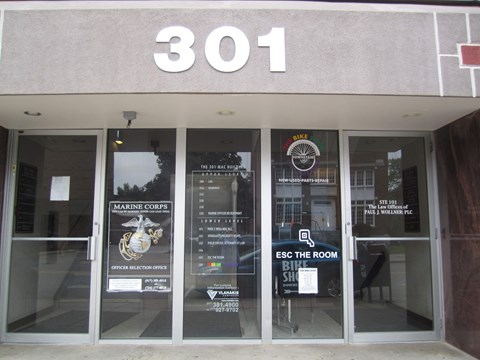 The front of a building with the number 301 on it.