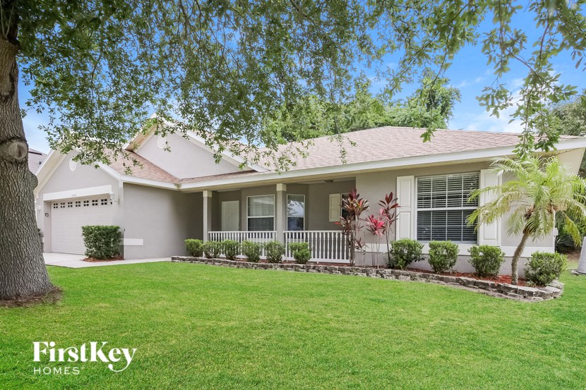 A house with a tree in front of it.