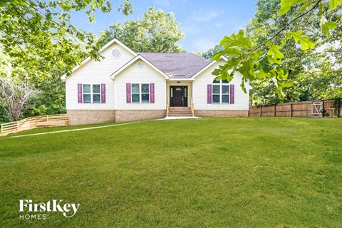 A house with a lawn in front of it.