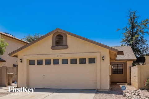 A two-car garage is attached to a house.