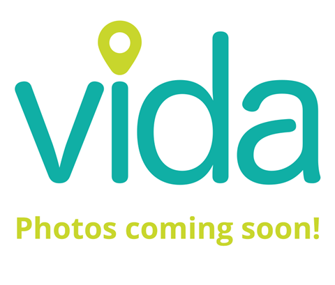 A logo with a location pin and the word "vida" with a note that says "Photos coming soon!"
