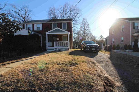 a car parked in front of a house