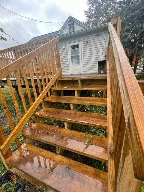 a house with wooden stairs in front of it