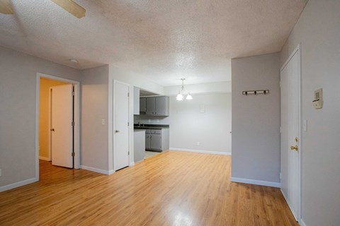 A kitchen area with a refrigerator, microwave, and oven.