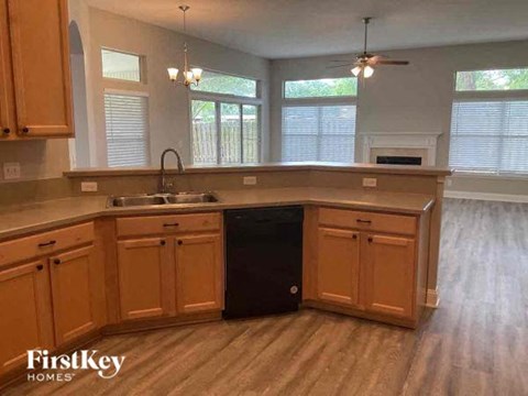 a kitchen with wooden cabinets and a sink