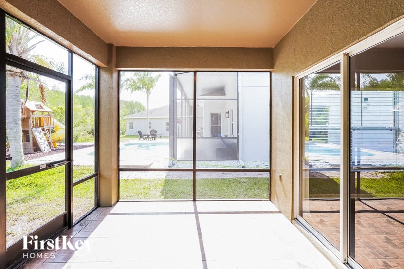 a living room with sliding glass doors to a patio