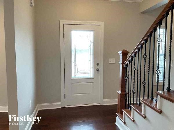 a white door in a house next to a staircase