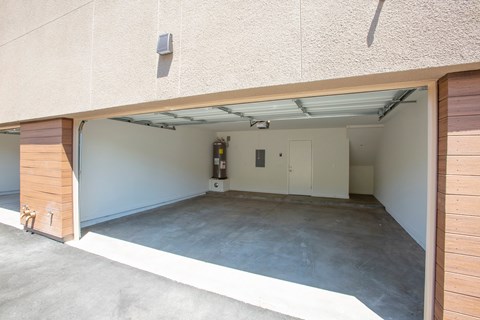 the inside of a garage with an open door