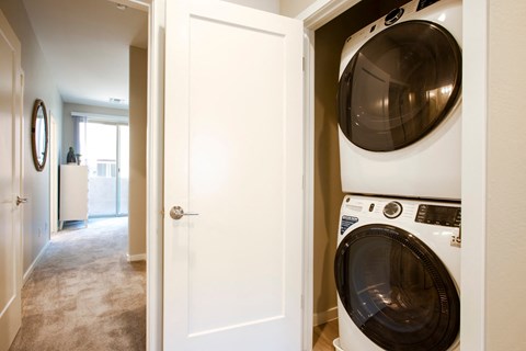 a washer and dryer in a closet in a home