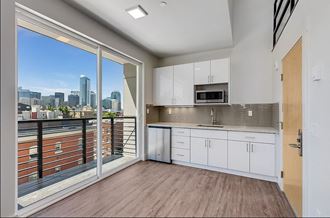 an open kitchen with a view of the city