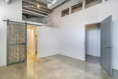 a room with white walls and a sliding door