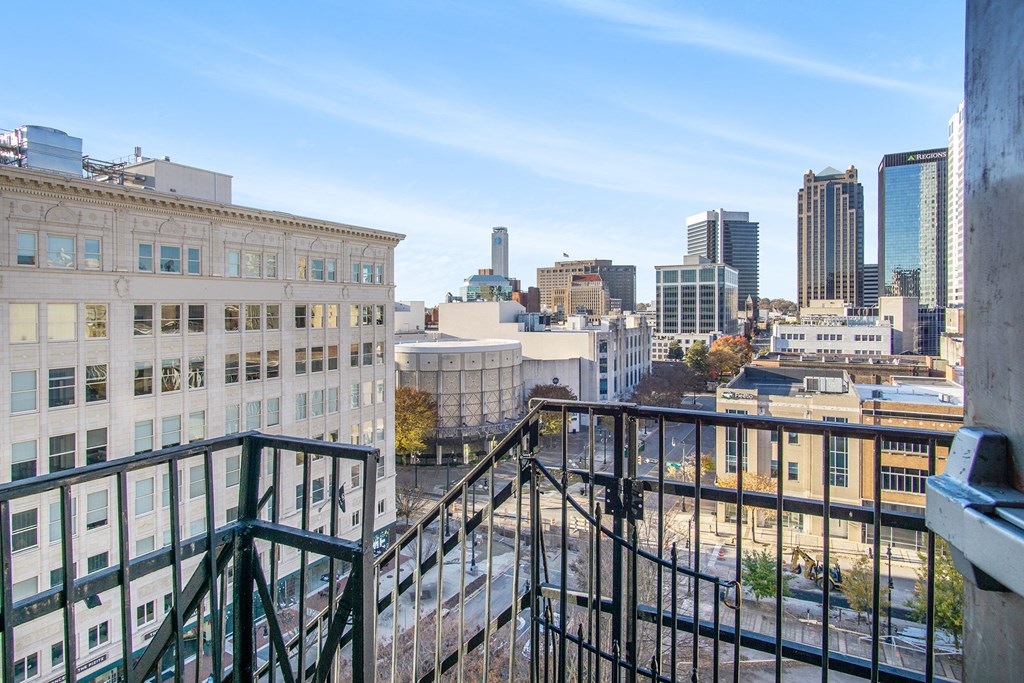 a balcony with a view of the city